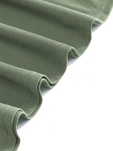 Close-up macro view of breathable olive green pique fabric for quick-dry polo shirt