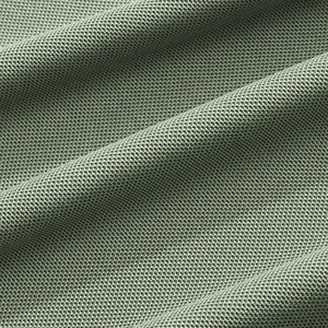 Detailed view of breathable sage green piqué fabric texture for men's polo shirt