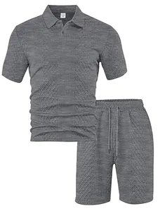 Close-up detail of grey jacquard knit fabric on men's polo shirt and shorts set