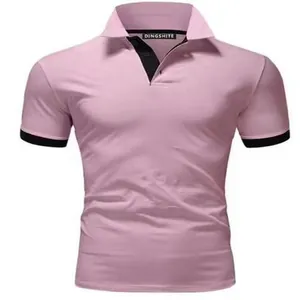 Close-up of pink men's polo shirt with black contrast collar and sleeve cuffs detail.