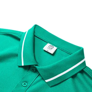 Detailed macro view of green polo shirt collar with white stripe and size label