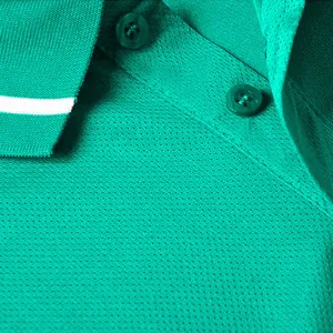 Detail macro view of teal quick-dry polo shirt showing breathable mesh fabric and buttons