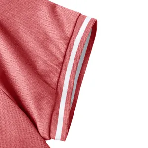 Close-up of pink quick-dry polo shirt sleeve featuring a white striped ribbed cuff