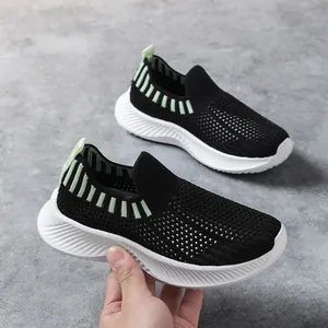 Zapatillas de running para niños transpirables con un elegante diseño de malla en blanco y negro