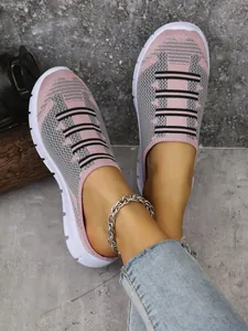 Detailed view of pink and grey breathable flyknit mesh slip-on mule sneakers for women