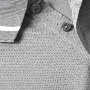 Detailed view of breathable mesh fabric and buttons on a quick-dry unisex polo shirt