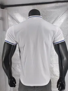 Back view of a white quick-dry polo shirt with blue striped collar and cuffs details