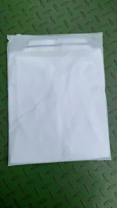 White quick-dry polo shirt neatly packed in a frosted zipper bag for safe shipping
