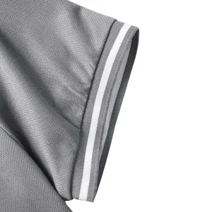 Close-up of grey quick-dry polo shirt sleeve featuring white striped ribbed cuffs details