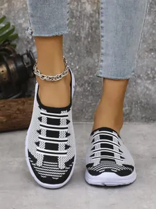 Front view of stylish black and white knit half-mule breathable casual shoes for women
