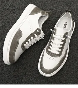 Detailed overhead view of men's retro suede sneakers with white and olive green panels