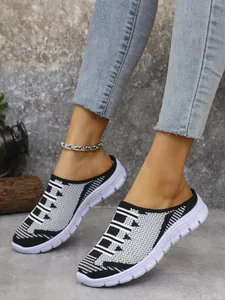 Detail of breathable fly-knit slip-on mules for women in a casual outdoor setting