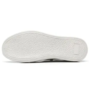 Detailed close-up view of the durable non-slip white rubber sole for men's casual shoes