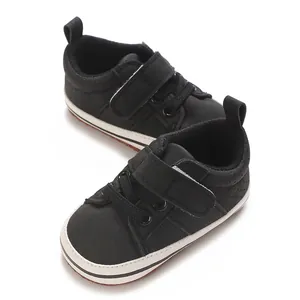 Detailed view of cute black baby boy casual walking shoes with soft soles and straps