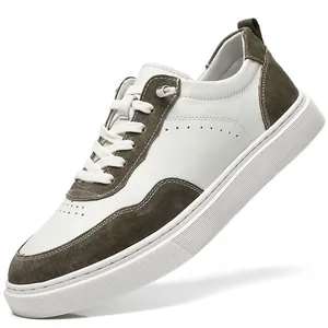 Detail view of men's retro low-top sneakers crafted from white leather and olive suede