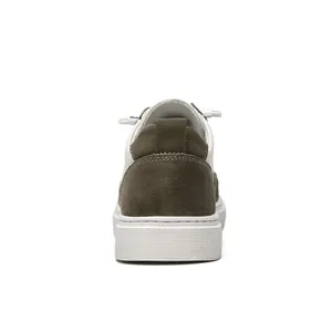 Rear view of men's low-top casual shoes featuring olive green suede heel detail