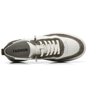 Top view of men's white and taupe suede retro casual sneakers with fashion printed insole
