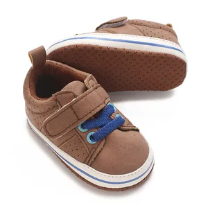 Detailed view of brown baby boy walker shoes with soft non-slip sole and hook-loop strap