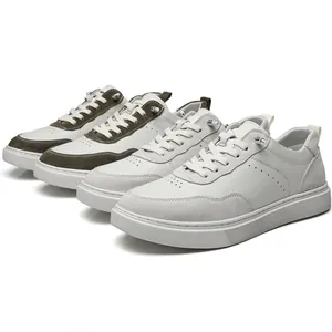 Close-up detail of vintage suede men's casual sneakers in white and grey color palette.