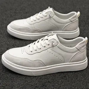 Detailed view of white suede retro board shoes for men featuring a soft rubber sole