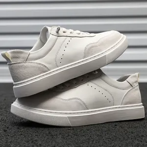 Detailed side view of premium off-white suede men's sneakers with thick rubber soles