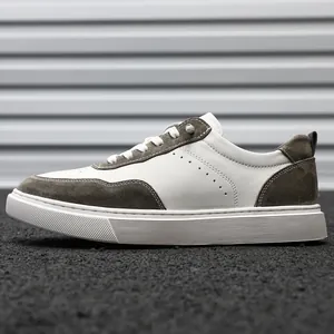 Detailed side view of retro white and grey suede low-top sneakers for men with white soles
