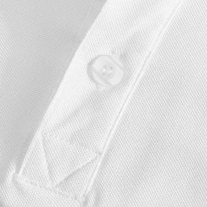 Close-up macro detail of a white breathable pique polo shirt showing fabric texture and button