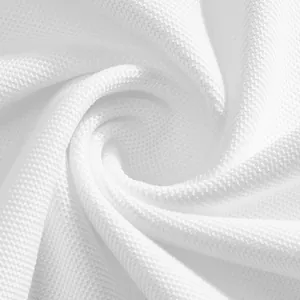 Detailed close-up of white pique fabric showing breathable mesh texture for golf polo shirts.