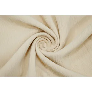 Detailed view of beige crinkle textured fabric for summer sexy solid color romper