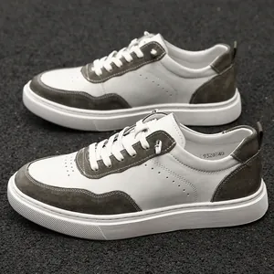 Detailed side view of men's low-top vintage suede sneakers with white leather accents