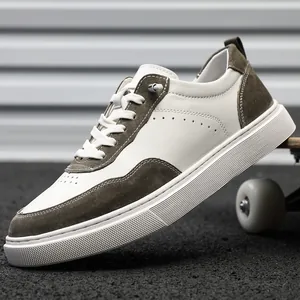 Detailed side view of retro men's suede board shoes in off-white and olive green