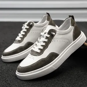 Close-up view of retro men's casual sneakers with grey suede and white leather panels
