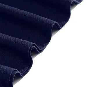 Close-up detail of navy blue breathable piqué fabric texture for summer polo shirt