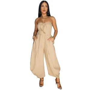 Khaki strapless wide-leg jumpsuit featuring a chest bow detail and convenient side pockets