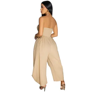 Elegant back view of a beige strapless wide-leg jumpsuit shown on a female model