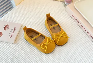 Premium yellow suede Mary Jane shoes for girls featuring a cute bow tie and soft flat soles