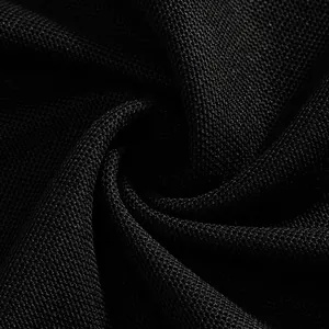Close-up macro shot of breathable black mesh pique fabric texture for a Polo shirt