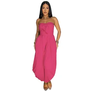 Elegant hot pink strapless tube top jumpsuit with a decorative front knot and loose fit