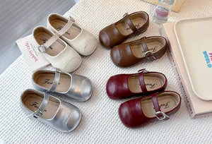 Detail view showing four colors of girls' soft sole Mary Jane flats: beige, brown, silver, red