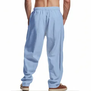 Detail back view of men's loose light blue breathable linen trousers for summer wear