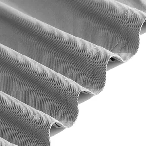 Macro detail of breathable grey pique fabric texture and stitching on a classic polo shirt