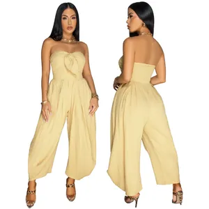 Front and back view of sexy strapless wide leg jumpsuit in solid pale yellow color