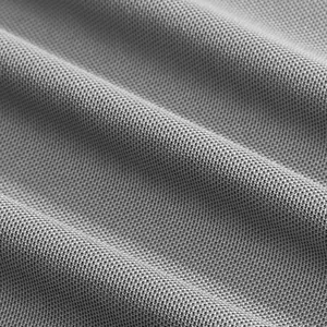 Macro detail of grey breathable piqué fabric for a professional golf polo shirt