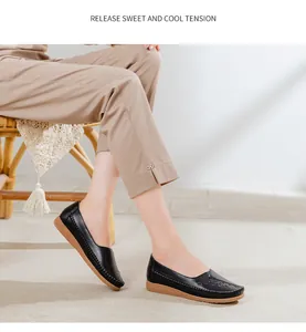Detailed view of comfortable black leather loafers featuring soft brown soles for women.