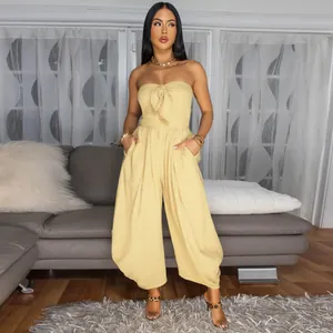 Elegant yellow tube top strapless jumpsuit with front knot detail for chic summer style