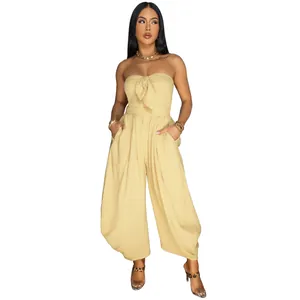 Elegant strapless solid color wide-leg jumpsuit featuring a stylish tie-front detail design