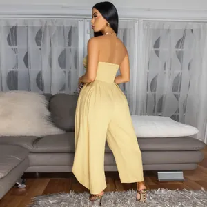 Fashionable summer yellow strapless wide-leg jumpsuit featuring elegant back pleat details