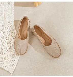 Top view of comfortable beige women's loafers with perforated detail and cushioned insole.