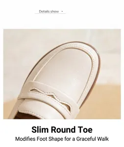 Macro detail of the rounded toe and premium soft leather texture on beige loafers