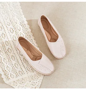 Detail shot of comfortable light pink slip-on loafers with breathable hollow pattern